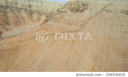 Colorful high mountains and a canyon made of clay Colorful high mountains and a canyon made of clay 108426029