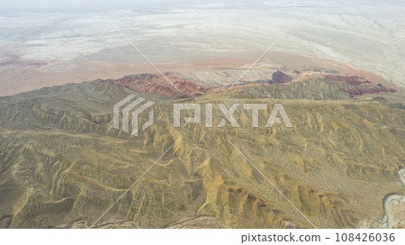 Colorful high mountains and a canyon made of clay 108426036