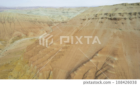 Colorful high mountains and a canyon made of clay Colorful high mountains and a canyon made of clay 108426038