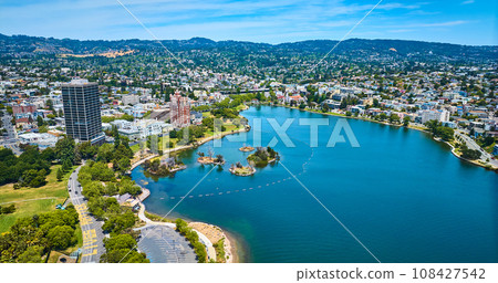 Bellevue Staten building on Lake Merritt shore with Pelican Island aerial of residential area 108427542
