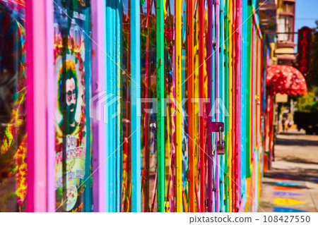 Pride rainbow gate with padlock side view along street Pride rainbow gate with padlock side view along street 108427550