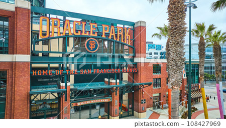 Aerial Oracle Park Willie Mays Gate ballpark entrance with palm trees and sign 108427969