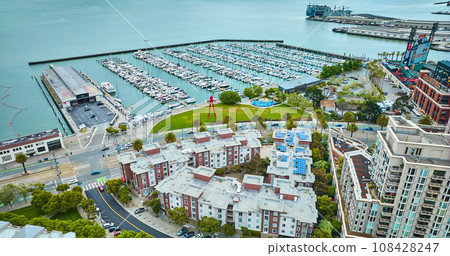 Aerial over buildings looking at Pier 40 with South Beach Harbor in the bay 108428247