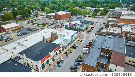 Aerial downtown Auburn Indiana with shop buildings 108428418