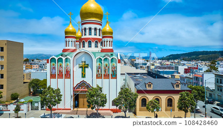 Gorgeous summer day with blue sky and white clouds over entrance to Holy Virgin Cathedral aerial Gorgeous summer day with blue sky and white clouds over entrance to Holy Virgin Cathedral aerial 108428460