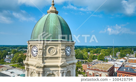 Close up aerial of Columbia City courthouse clock tower with dome and blue sky Close up aerial of Columbia City courthouse clock tower with dome and blue sky 108428794