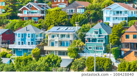 Seven houses on a hillside close up of six multistory homes aerial 108428840