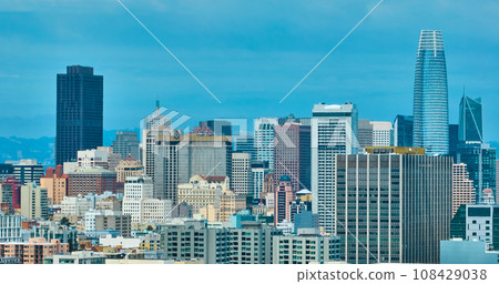 Aerial wall of San Francisco skyscraper buildings under hazy blue sky Aerial wall of San Francisco skyscraper buildings under hazy blue sky 108429038