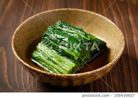 Dipping with spinach Dipping with spinach 108430687