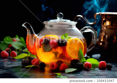 A glass teapot with fruit oolong tea in glass kettle on wooden table. Chinese traditional tea ceremony A glass teapot with fruit oolong tea in glass kettle on wooden table. Chinese traditional tea ceremony 108431047