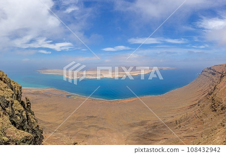 View of Loa Graciosa island off Lanzarote from Mirador del Rio viewpoint View of Loa Graciosa island off Lanzarote from Mirador del Rio viewpoint 108432942