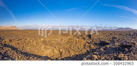 Panoramic view over the barren volcanic Timanfaya National Park on Lanzarote Panoramic view over the barren volcanic Timanfaya National Park on Lanzarote 108432963