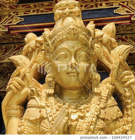Balinese Hindu God golden Shiva Durga statue on a sacred Hindu temple in Indonesia Balinese Hindu God golden Shiva Durga statue on a sacred Hindu temple in Indonesia 108434527
