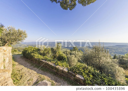 View over the hills of central Istria from the city walls of Groznjan during the day 108435896