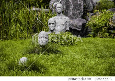 sculptural group of a man goes underground. sculptural group of a man goes underground. 108436629