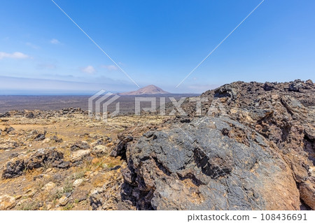 Panoramic view over the barren volcanic Timanfaya National Park on Lanzarote Panoramic view over the barren volcanic Timanfaya National Park on Lanzarote 108436691