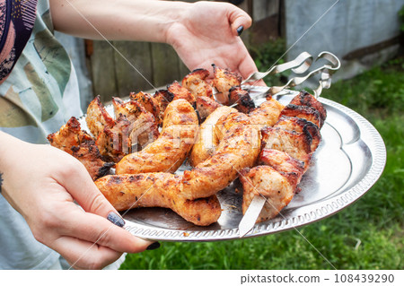 Meat and sausage on a grill closeup Meat and sausage on a grill closeup 108439290