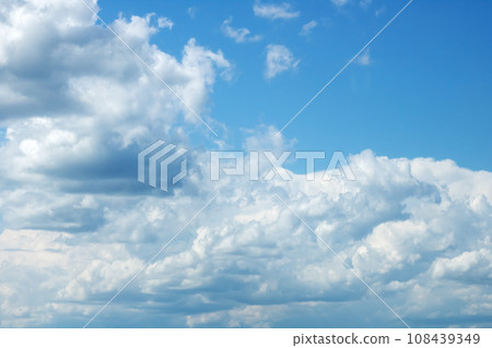 White clouds in bright blue sky closeup 108439349