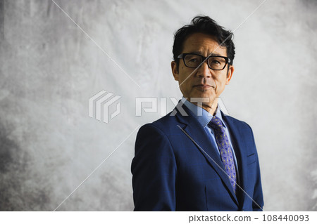 A middle-aged businessman wearing a suit A middle-aged businessman wearing a suit 108440093