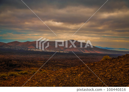 Amazing panoramic landscape of volcano in Timanfaya national park. Popular touristic in Lanzarote island Canary islans Spain. Artistic picture. Travel concept 108440816