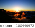 A sea of clouds burning in the morning sun 108440972