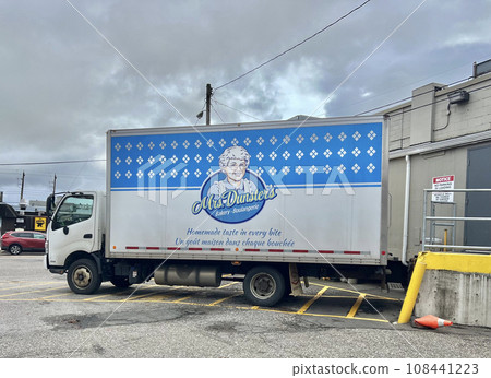 Foreign sweets truck loading goods in a supermarket parking lot Foreign sweets truck loading goods in a supermarket parking lot 108441223