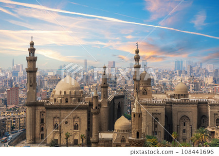 The Mosque-Madrassa of Sultan Hassan at sunset and the city view, Cairo, Egypt 108441696