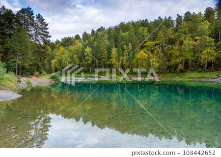 Scenic view of autumn trees reflecting in calm blue lake at Altai, Russia 108442652