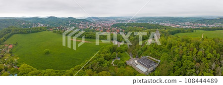 Drone panorama of thuringian city Eisenach with Wartburg castle during daytime Drone panorama of thuringian city Eisenach with Wartburg castle during daytime 108444489