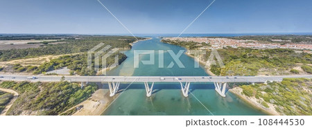 Panoramic view of the freeway bridge over the Rio Mira near the town of Bairro Monte Vistoso 108444530