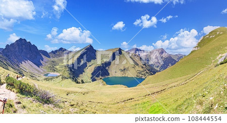 Panoramic view over the mountains on the Three Lakes Route in the Tannheimer Valleyi n summer 108444554
