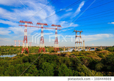 High voltage power line across the Dnieper river on Khortytsia island in Zaporizhia, Ukraine 108444669