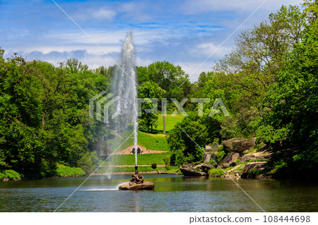 View of a lake with Snake Fountain in Sofiyivka park in Uman, Ukraine View of a lake with Snake Fountain in Sofiyivka park in Uman, Ukraine 108444698
