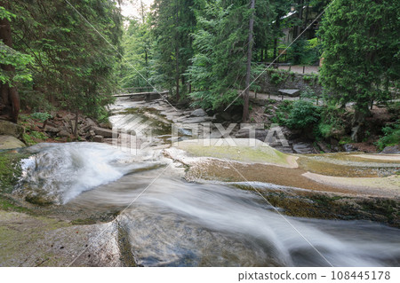 Mountain river Mumlava, Krkonose national park, Czech Republic, summer afternoon, footbridge above river, Mumlava waterfall. Mountain river Mumlava, Krkonose national park, Czech Republic, summer afternoon, footbridge above river, Mumlava waterfall. 108445178