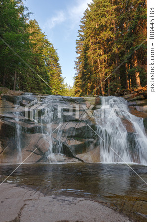 Mumlava waterfall. Mountain river Mumlava, Krkonose national park, Czech Republic, summer afternoon. Mumlava waterfall. Mountain river Mumlava, Krkonose national park, Czech Republic, summer afternoon. 108445183