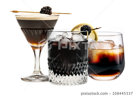 Set of Black Russian cocktails in crystal-clear glass sits against a white background Set of Black Russian cocktails in crystal-clear glass sits against a white background 108445337