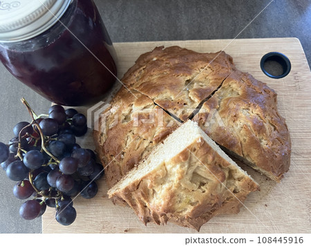 Delicious homemade grape jam and scones on the table 108445916