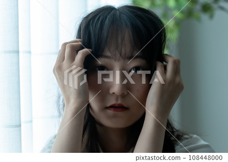 A woman with an ennui atmosphere 108448000