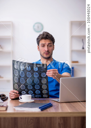 Young male doctor radiologist working in the clinic Young male doctor radiologist working in the clinic 108448024