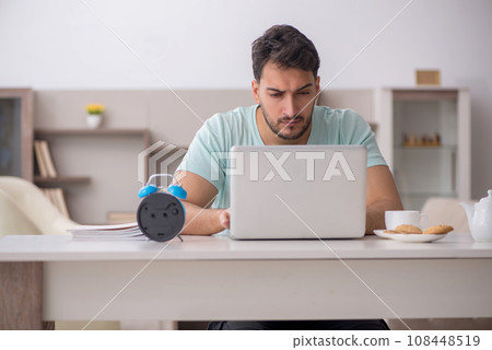 Young male freelancer working from home 108448519