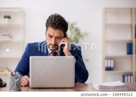 Young male employee working in the office 108448522