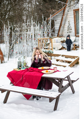portrait of a young girl in the winter drink 108449628