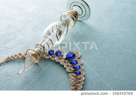 Perfume bottle and necklace 108450769