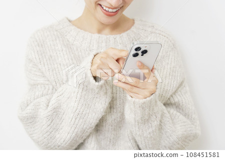 Woman using smartphone White background Woman using smartphone White background 108451581