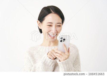 Woman using smartphone White background Woman using smartphone White background 108451663
