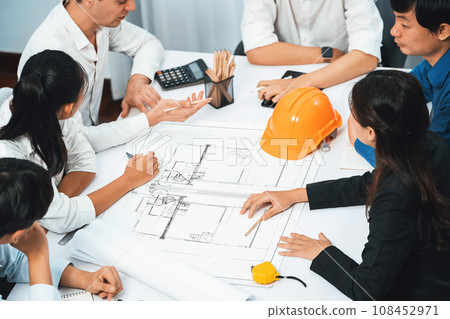 Diverse group of civil engineer and client working on architect. Prudent 108452971