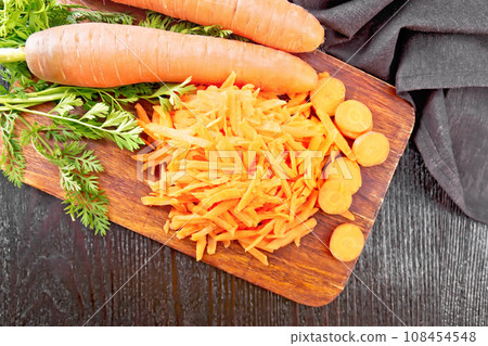 Carrots grated on board top 108454548