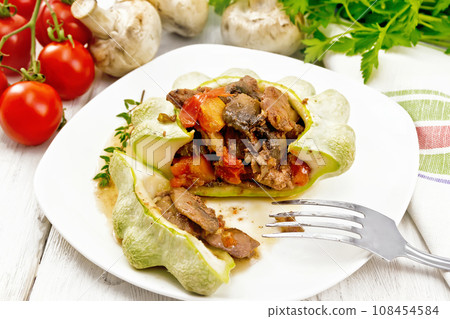 Patisson stuffed with liver and mushrooms in plate on white board Patisson stuffed with liver and mushrooms in plate on white board 108454584