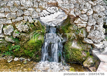 Spring from stone gutter 108454786