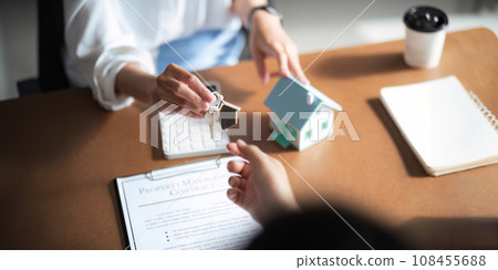 Real estate agent to his discussion and consult about house contracts client after signing contract, concept for real estate, moving home or renting property 108455688